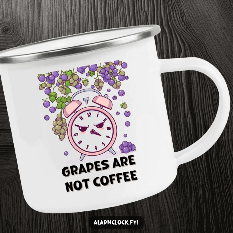 Funny camping mug featuring a grumpy alarm clock being pelted by tiny grapes, perfect for hot drinks during challenging outdoor adventures.