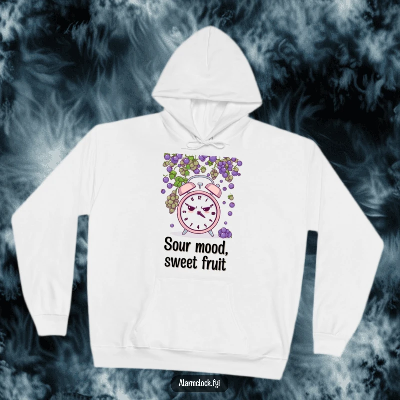 Funny hoodie print of a grumpy alarm clock being pelted by tiny grapes, symbolizing frustration and a humorous take on bad days.
