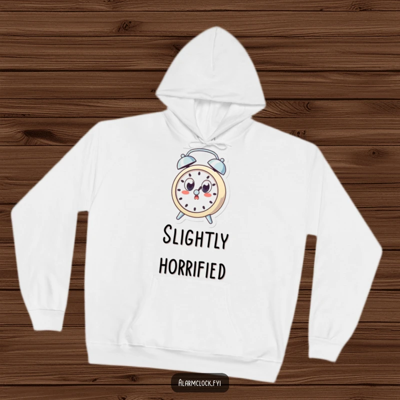 Funny hoodie featuring a surprised alarm clock character with wide eyes, startled by its own ring, offering cozy and humorous comfort.