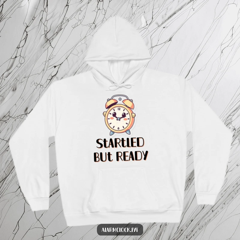 Funny hoodie depicting a cute alarm clock character leaping from a bell with a startled expression, a cozy and humorous gift idea.